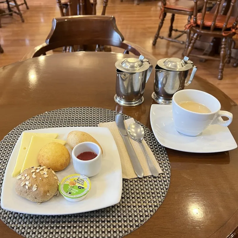 hot chocolate with a plate of breads and cheeses